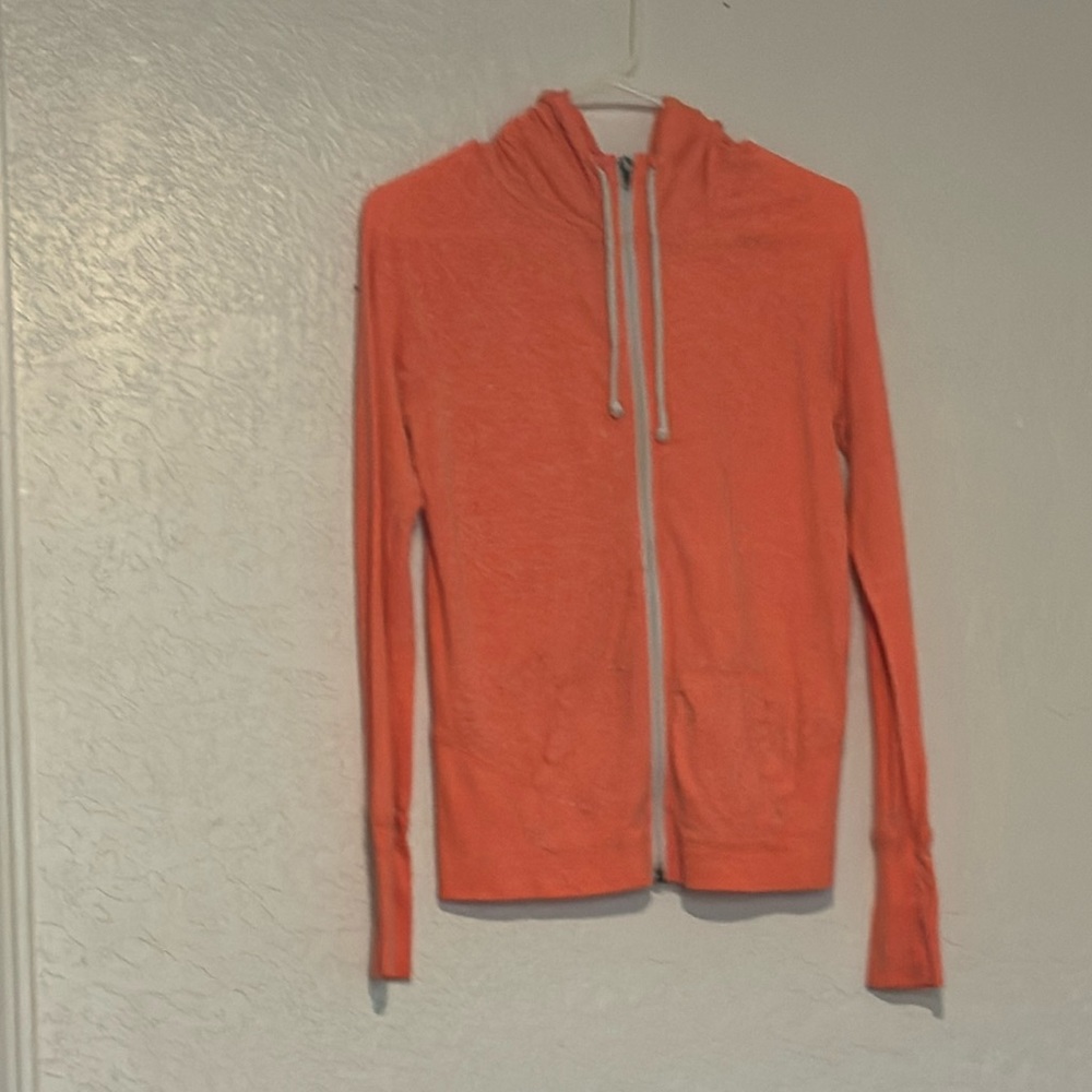 Zip up hoodie. Made from cotton and polyester. Brand is So. Size medium.